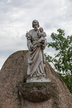 The Old Statue Of St. Joseph With Jesus In His Arms At The Church In Sadow Near Lubliniec In Silesia