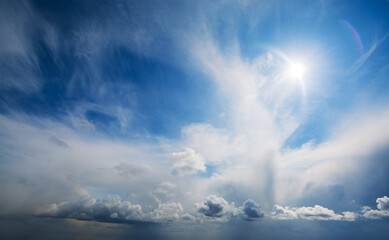 Wall Mural - picturesque aerial view of changing weather from clear blue sky with bright sunshine and just a few 