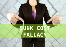 SUNK COST FALLACY Phrase On The Screen.