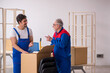 © Elnur - Two male professional movers doing home relocation