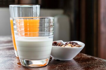 Wall Mural - Western breakfast set, fresh milk, freshly squeezed orange juice and cornflakes