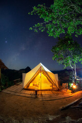 Wall Mural - bell tent camping white in the midst of nature and the milky way at night.