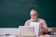 © Elnur - Old male teacher in front of blackboard