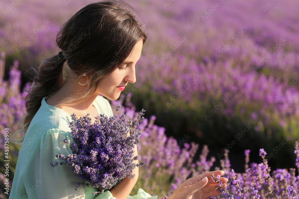 Beautiful young woman in lavender field