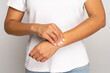 © DimaBerlin - Woman holding fingers on wrist checking pulse. Tired female touching arm to measure heart beat or blood pressure, massages wrist after working at computer, pressing vein with hand. Arthritis concept.