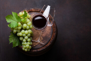 Wall Mural - White grape, glasses on old wine barrel