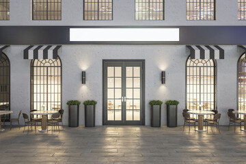 Creative concrete cafe exterior with terrace furniture and empty white sign at night. Mock up, 3D Rendering.