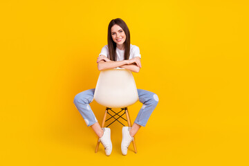 Poster - Full size photo of happy good mood beautiful lovely woman sit chair having break pause isolated on yellow color background