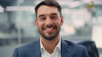 Poster - Portrait of a Confident Happy Businessman Wearing a Casual Suit, Looking at Camera, Genuinely and Charmingly Smiling. Successful Experienced Man Working in Diverse Company Office.