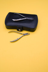 Poster - Black leather closed manicure set bag and nipper with copy space