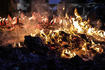 hinese hungry ghost festival burning flame fire glowing ashes firefly colourful variety prayer paper joss money fake currency joss stick mini fag food fruit offering