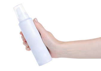 Bottle of spray hair foam in hand on white background isolation