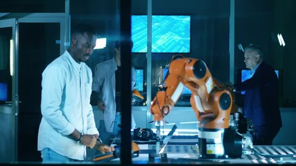 Wall Mural - group of engineers are researching robots in the it lab