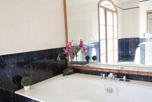 Black Marble Surrounding Bathtub In Luxury Bathroom