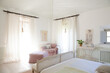 Sun shining through window into luxury bedroom