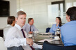 © KOTO - Business people sitting in meeting