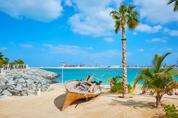 Sticker - The sea coast with old boat, La Mer beach, Dubai, UAE