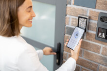 Opening Door With A Smart Phone And Keyboard On The Wall