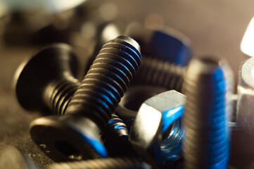 Sticker - Closeup shot of metal nuts and screws against a gray background