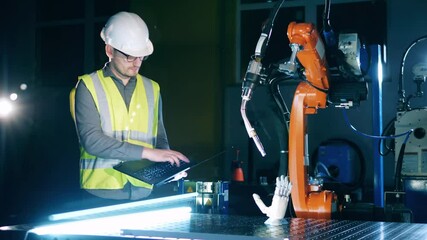 Wall Mural - construction engineer is observing cybernetic devices