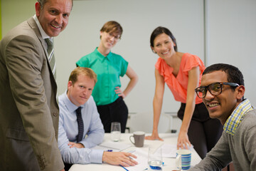 Business people smiling in meeting