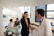 © KOTO - Doctor and businesswoman handshaking in meeting