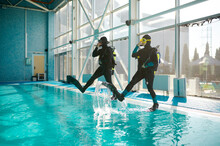 Woman And Male Divemaster, Course In Diving School