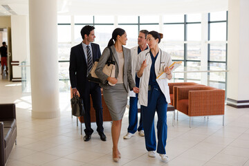 Wall Mural - Doctors and business people talking