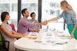 © KOTO - Business people shaking hands in meeting