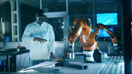 Wall Mural - african-american engineer is operating a robot in vr-device