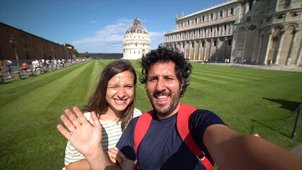 Wall Mural - Travel tourists friends taking photo selfi with smartphone in Pisa, Tuscany. happy couple in love traveling in Europe having fun taking self-portrait picture in Pisa by Leaning Tower of Pisa, Italy.