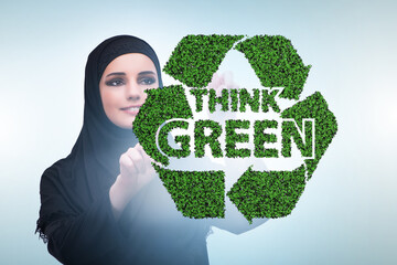 Wall Mural - Think green ecological concept with businesswoman