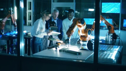 Wall Mural - robotics engineers are using vr-glasses to observe robots