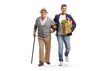 Canvas Print - Full length portrait of a son helping his elderly father with a grocery bag