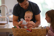 © KOTO - Father carrying baby in laundry basket