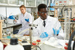 © JackF - Man proffesional lab scientist in glasses working with reagents and test tubes in laboratory