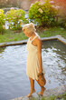 Woman walking by edge of pool