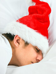 Wall Mural - Young Man sleep in Santa Hat