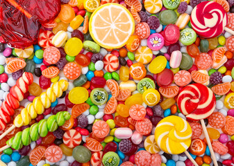 Wall Mural - Colorful lollipops and different colored round candy.