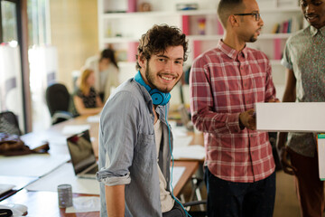 Men talking in office