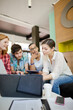 © KOTO - People working at laptop in office