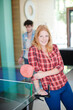 Woman posing with tennis table racket