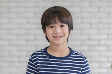 Wall Mural - Portrait of cute young kid Asian boy with smile face.