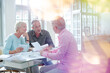© KOTO - Business people working together at table