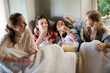 © KOTO - Group of teenagers throwing popcorn on themselves on sofa