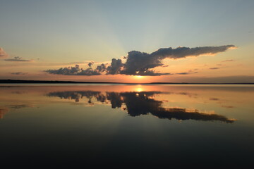 Wall Mural - reflection in the lake water of the sky at sunset