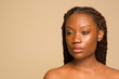 © Phiwo Ndlovu/Cultura Creative - Studio portrait of woman with braided hair