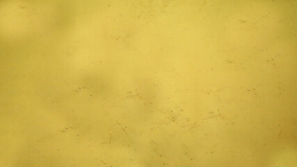 Wall Mural - Aged yellow background with black dots and roughness