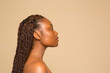 © Phiwo Ndlovu/Cultura Creative - Profile of shirtless woman with braided hair