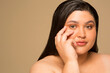 © Phiwo Ndlovu/Cultura Creative - Studio portrait of shirtless young woman